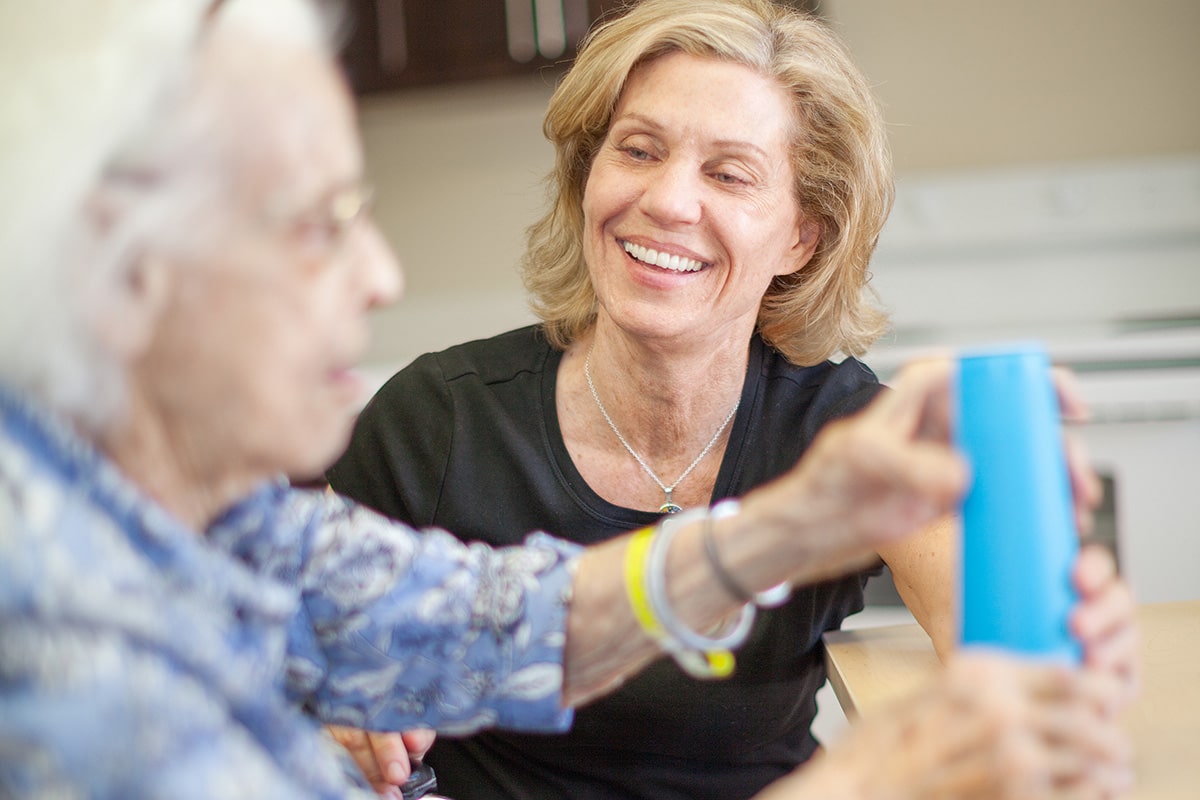 Two women smiling and laughing