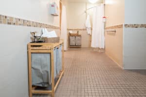 Bathroom with tile and towel racks