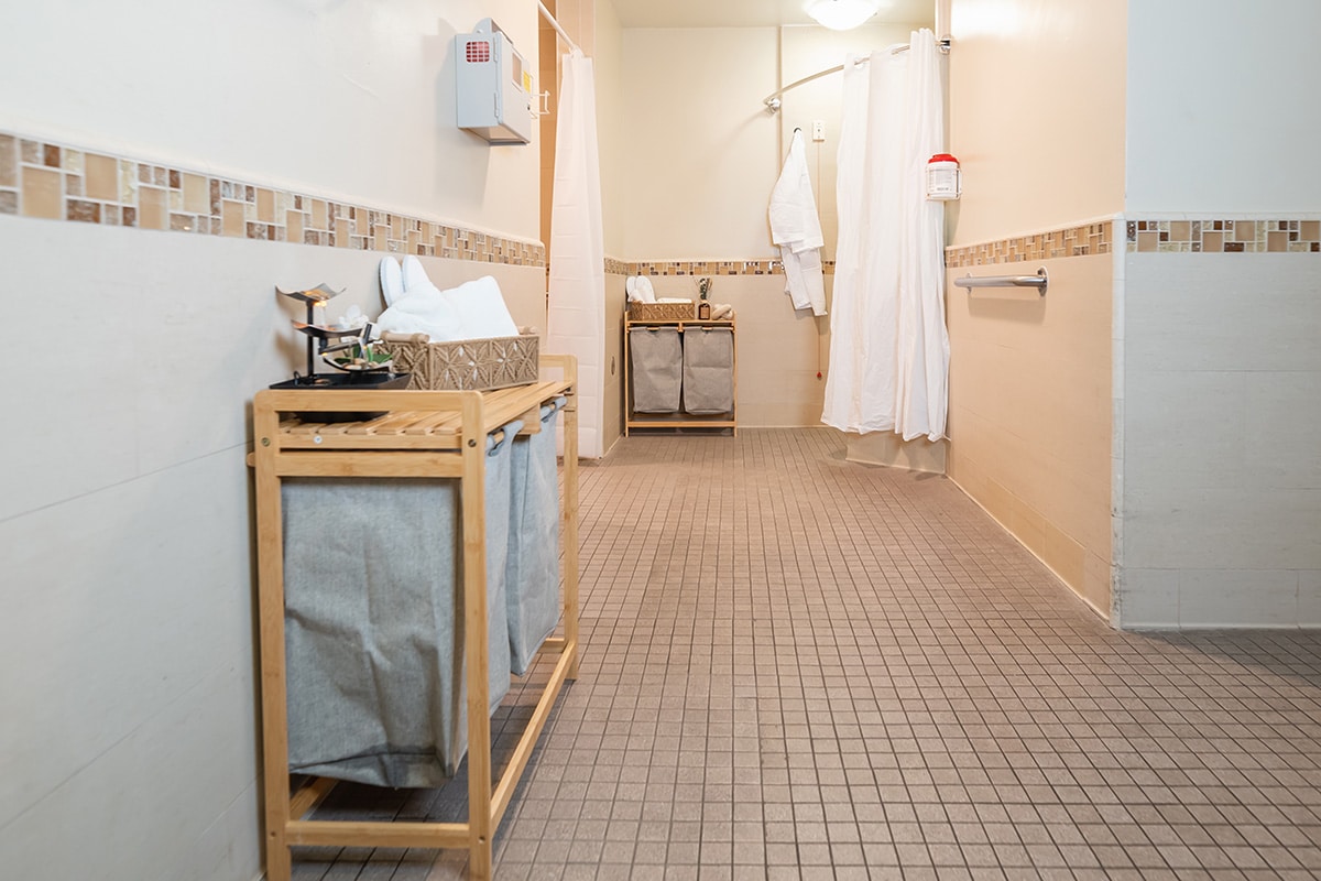 Bathroom with tile and towel racks